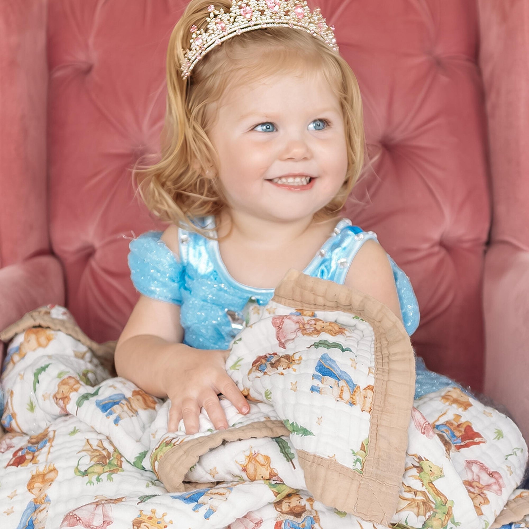 Natchiketa Fairytale organic cotton muslin toddler blanket with little girl in a chair dressed up like a princess