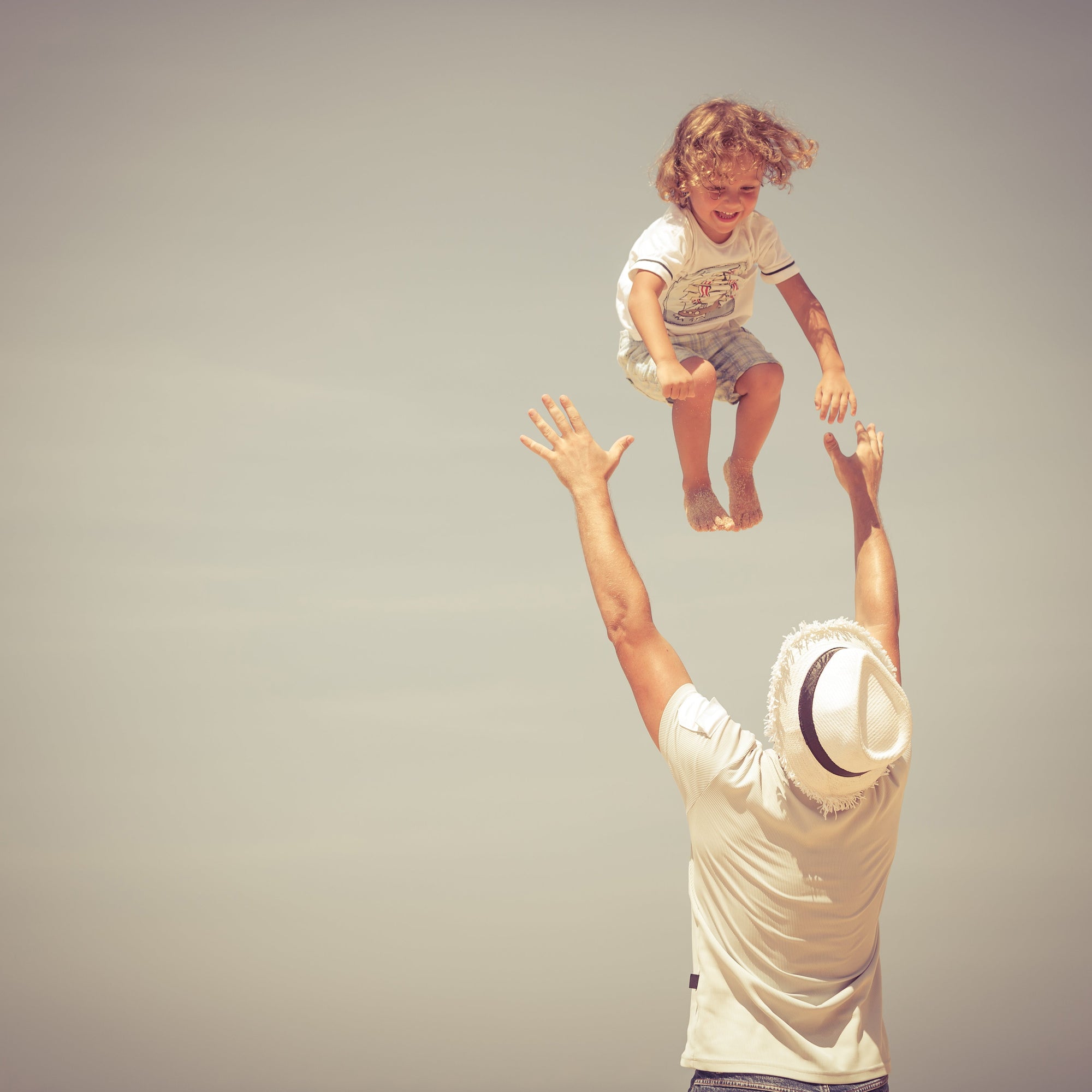 Kid playing with father