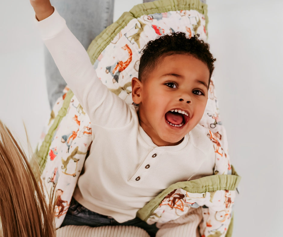 Boy wrapped in Natchiketa blanket